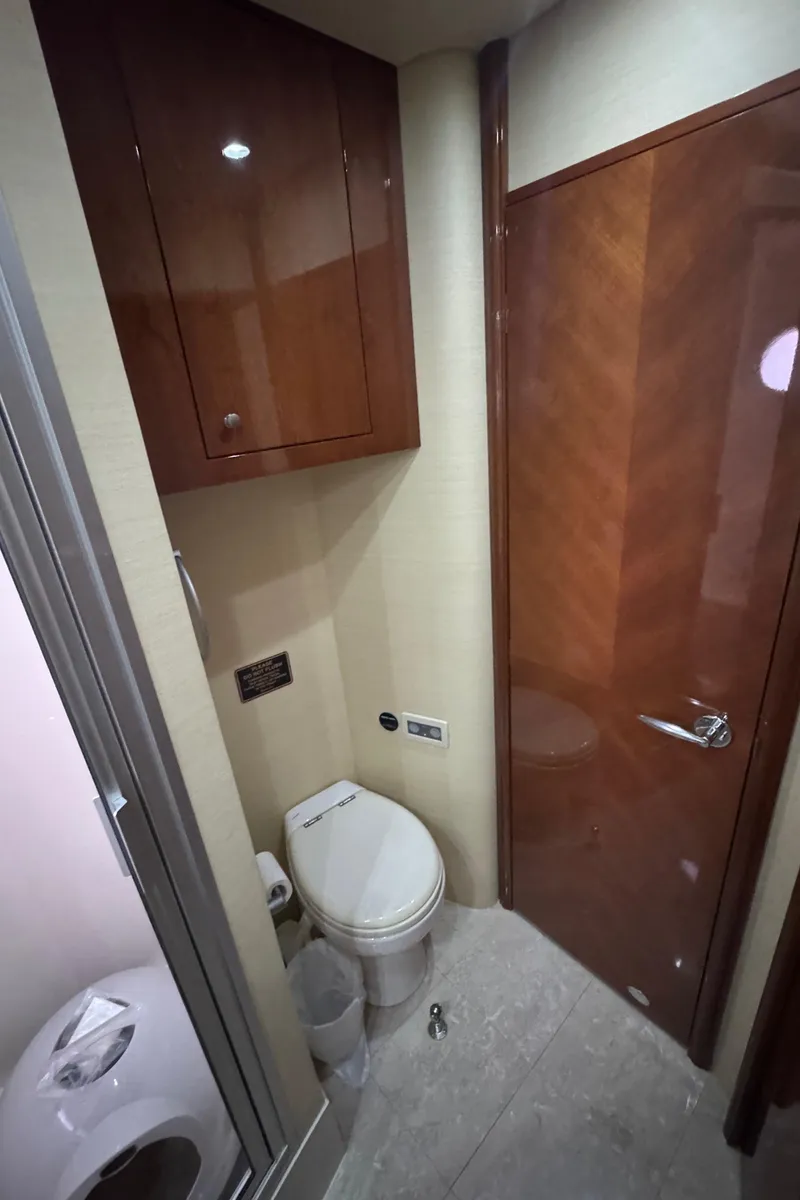 Slide: The Image of Luxury yacht bathroom interior, Marquis 65, 2006 model, featuring wooden cabinetry and modern fixtures. - 55