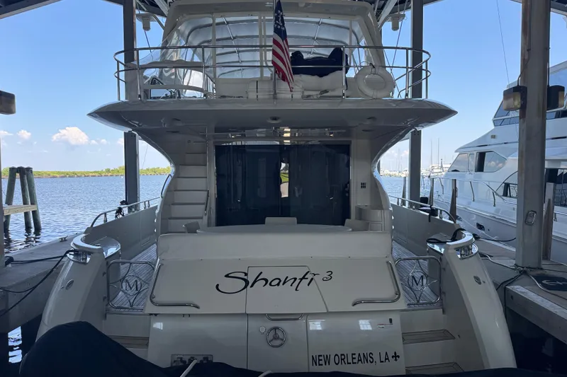Slide: The Image of Luxury 2006 Marquis 65 yacht docked, rear view with American flag, New Orleans. - 94