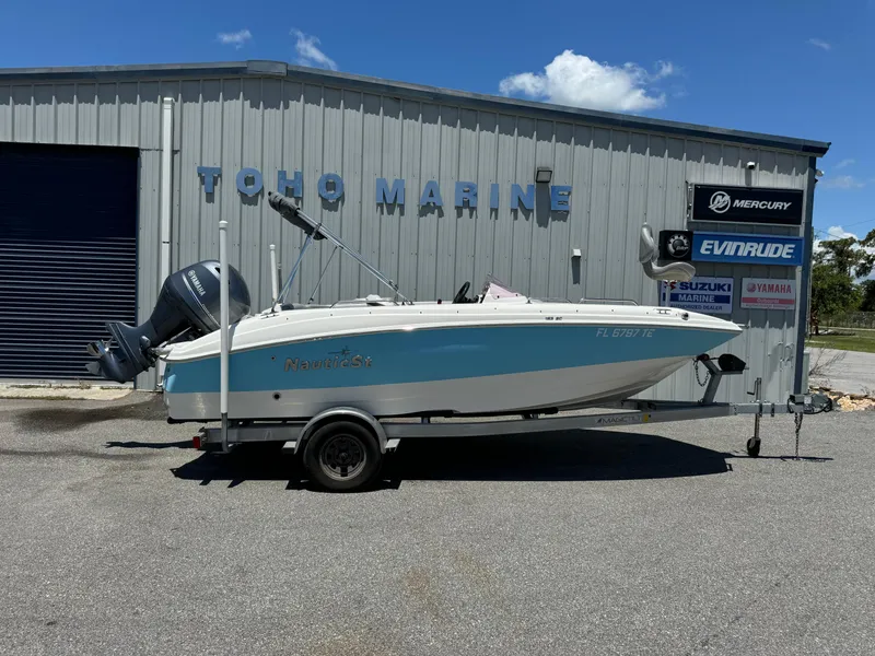 Slide: The Image of 2022 NauticStar 193SC boat on trailer at Toho Marine dealership. - 1
