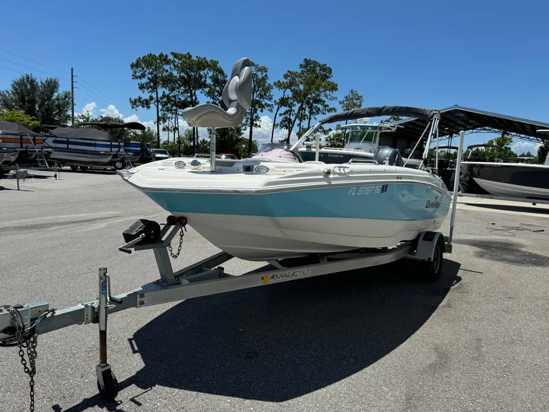 Slide: The Image of 2022 NauticStar 193SC boat on trailer in sunny outdoor setting. - 3