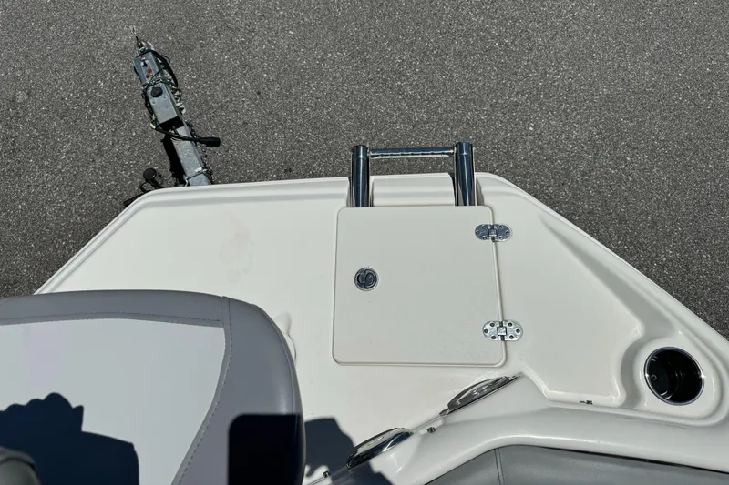 Slide: The Image of 2022 NauticStar 193SC boat deck with seating and storage compartment. - 7