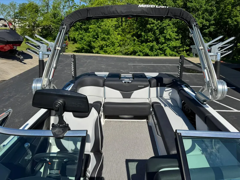 Slide: The Image of 2020 MasterCraft XT22 boat interior with sleek seating and modern design. - 11