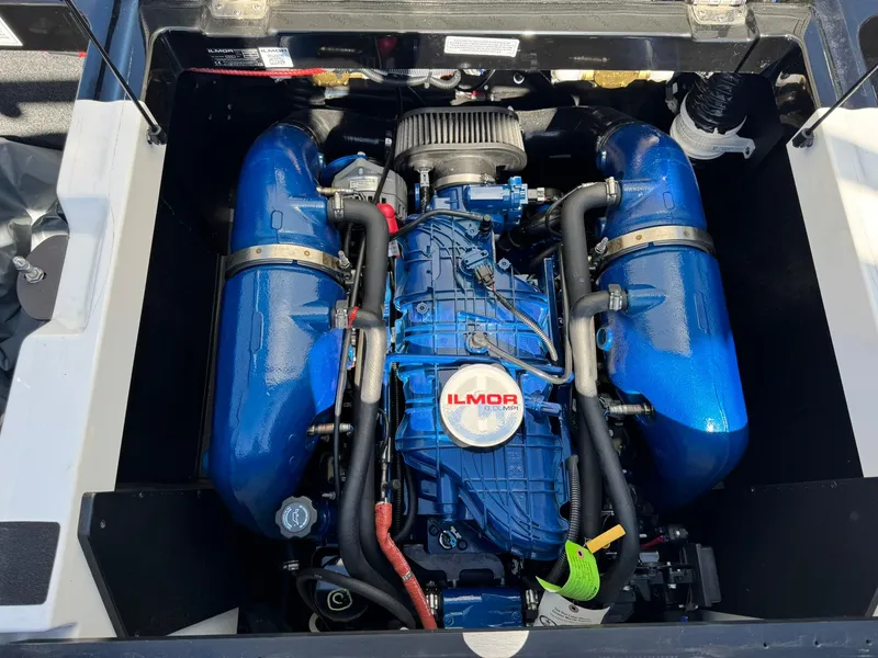 Slide: The Image of 2020 MasterCraft XT22 engine compartment with blue Ilmor engine components. - 14