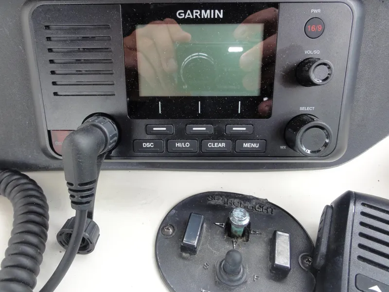 Slide: The Image of Garmin marine radio and controls on a 1997 Sea Ray 330 Express boat. - 19