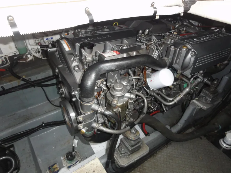 Slide: The Image of Engine compartment of a 1997 Sea Ray 330 Express boat, showcasing detailed mechanical components. - 30
