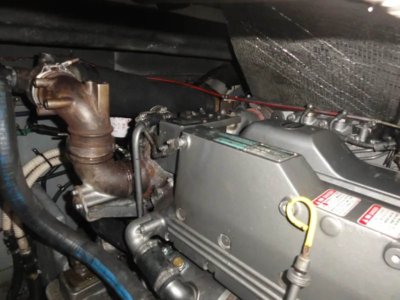 Slide: The Image of Engine compartment of a 1997 Sea Ray 330 Express boat, showing mechanical components. - 33