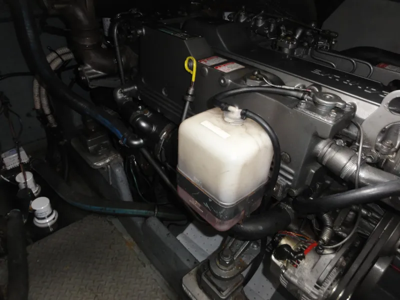Slide: The Image of Engine compartment of a 1997 Sea Ray 330 Express boat, showing detailed mechanical components. - 36
