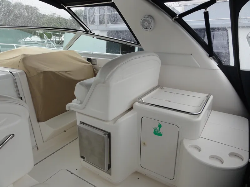 Slide: The Image of 1997 Sea Ray 330 Express boat interior with seating and storage compartments. - 9