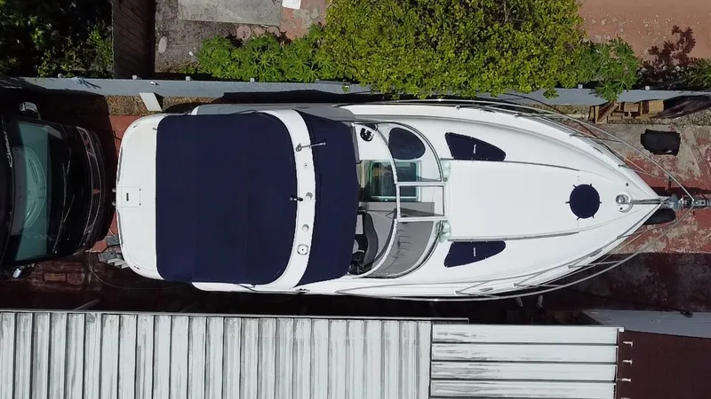 Slide: The Image of Overhead view of a 2006 Doral 310 Intrigue boat with a navy canopy. - 2