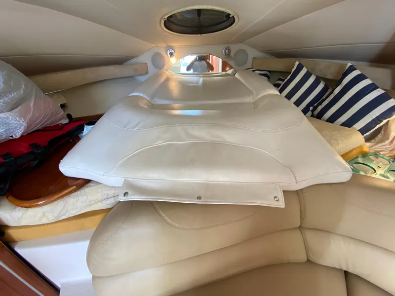 Slide: The Image of Interior cabin of 2006 Doral 310 Intrigue with cushions and striped pillows. - 21