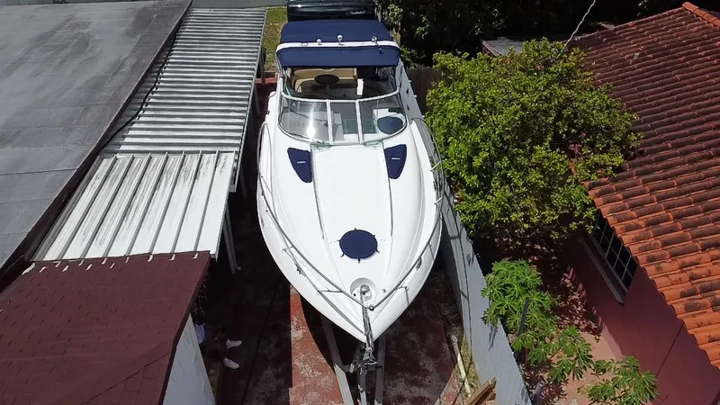 Slide: The Image of 2006 Doral 310 Intrigue boat parked between buildings, aerial view. - 6