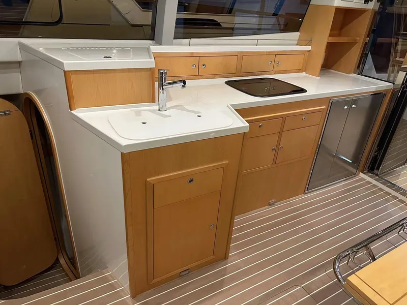 Slide: The Image of Modern kitchen area in 2025 ArrowCat 420 Flybridge yacht with sleek cabinetry and appliances. - 6