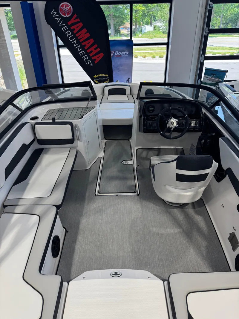 Slide: The Image of 2025 Yamaha Boats AR195 interior with sleek seating and modern dashboard. - 4