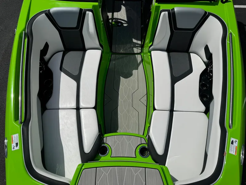 Slide: The Image of 2022 Yamaha Boats 255XD interior with green and white seating, modern design. - 15