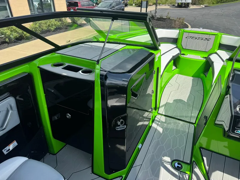 Slide: The Image of 2022 Yamaha Boats 255XD interior with vibrant green accents and modern design. - 18