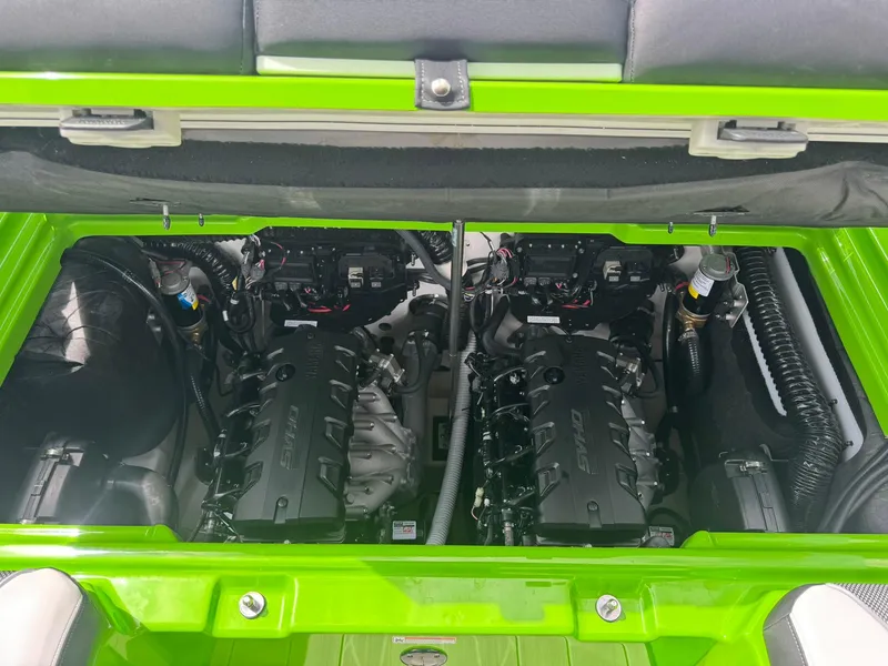 Slide: The Image of 2022 Yamaha Boats 255XD engine compartment with dual engines, vibrant green exterior. - 20