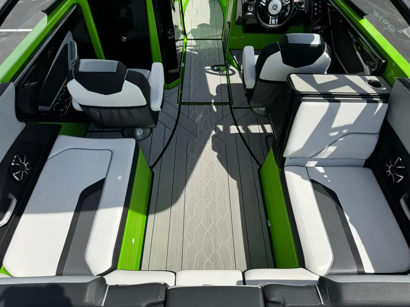 Slide: The Image of 2022 Yamaha Boats 255XD interior with modern seating and sleek design. - 9