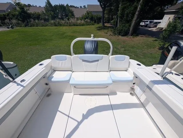 Slide: The Image of 2025 Robalo R207 Dual Console boat with spacious seating and sleek design. - 12