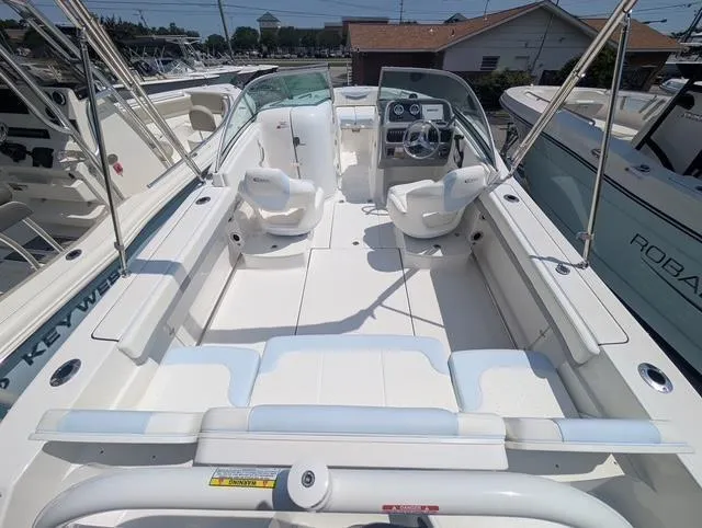 Slide: The Image of 2025 Robalo R207 Dual Console boat with spacious seating and modern dashboard. - 9