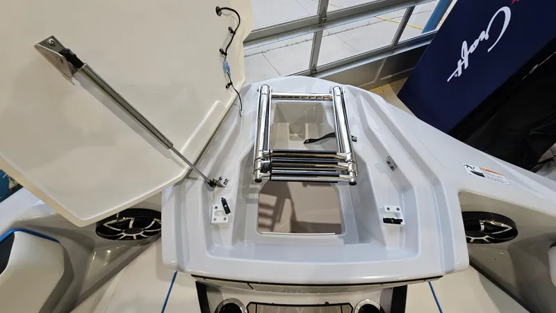 Slide: The Image of 2023 Yamaha Boats 222XD bow with open hatch and ladder, showcasing sleek design. - 22