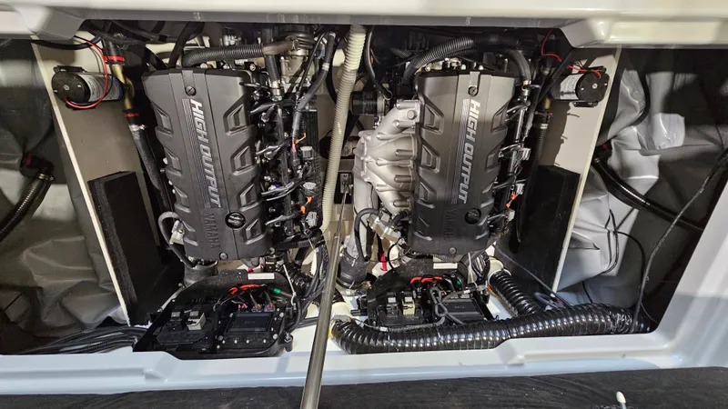 Slide: The Image of Twin engines of a 2023 Yamaha Boats 222XD, showcasing intricate mechanical details. - 27