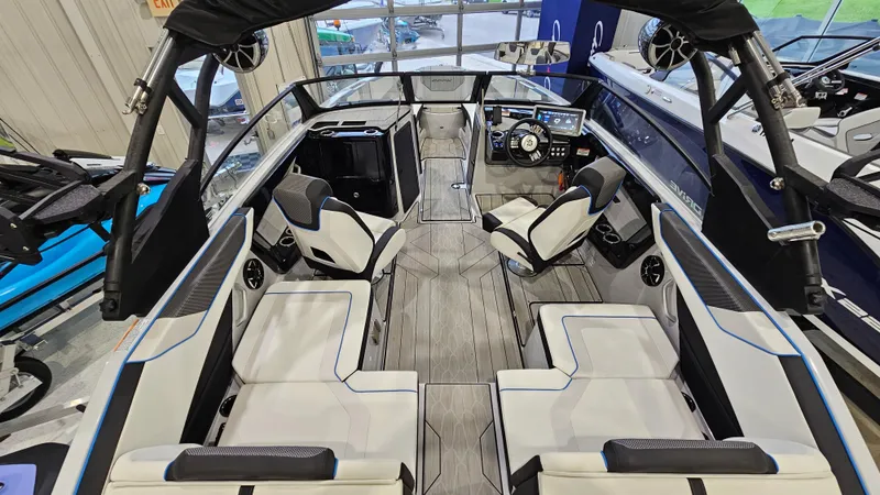 Slide: The Image of 2023 Yamaha Boats 222XD interior with sleek seating and modern dashboard. - 6