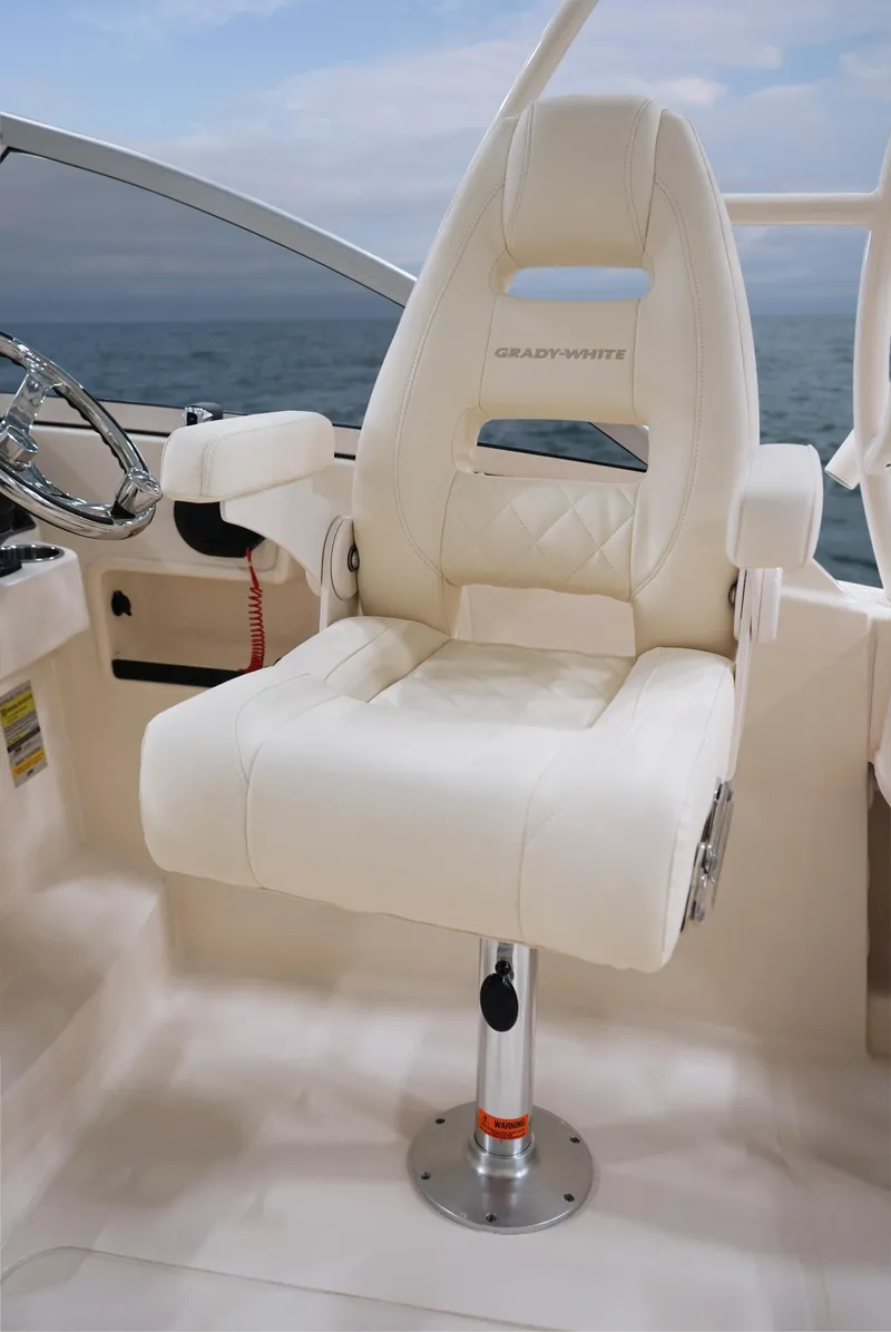 Slide: The Image of Luxury captain's chair on 2025 Grady-White 235 Freedom boat, featuring ergonomic design and premium materials. - 11