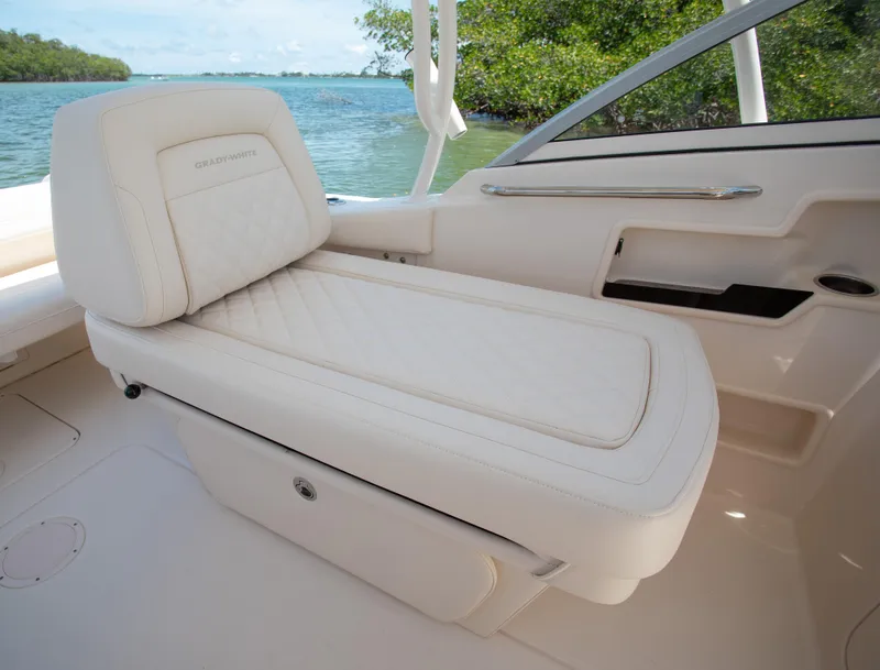 Slide: The Image of Luxurious seating on 2025 Grady-White 235 Freedom boat, with scenic water view. - 12