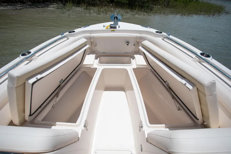 Slide: The Image of 2025 Grady-White 235 Freedom boat interior with open storage compartments. - 18