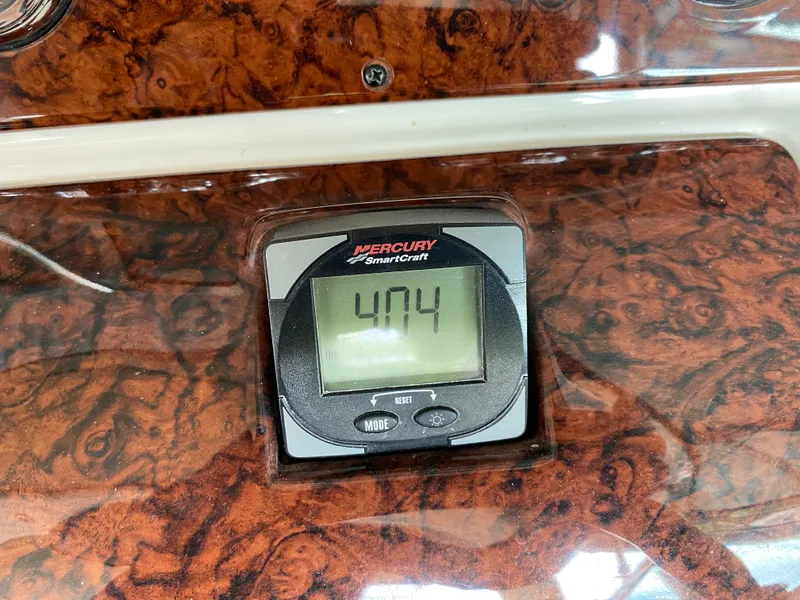 Slide: The Image of Mercury SmartCraft display on 2003 Sea Ray 290 Bowrider, showing 404 hours. - 24