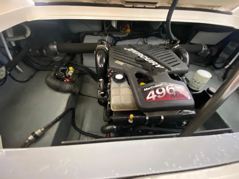 Slide: The Image of 2003 Sea Ray 290 Bowrider engine compartment with MerCruiser 496 MAG engine. - 32