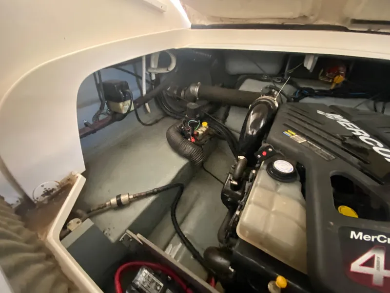 Slide: The Image of Engine compartment of a 2003 Sea Ray 290 Bowrider with MerCruiser engine. - 33