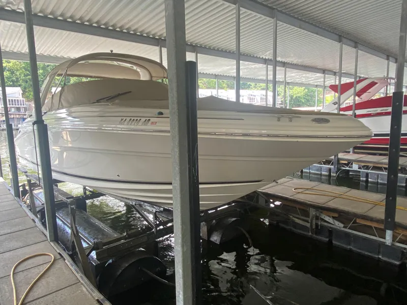 Slide: The Image of 2003 Sea Ray 290 Bowrider docked in covered marina. - 35