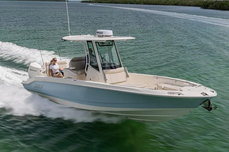 The Image of 2026 Boston Whaler 280 Dauntless boat on trailer, side view, clear blue sky. - 0