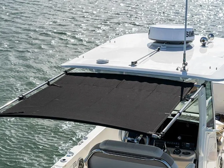 Slide: The Image of 2026 Boston Whaler 280 Dauntless boat interior with seating and storage area. - 10