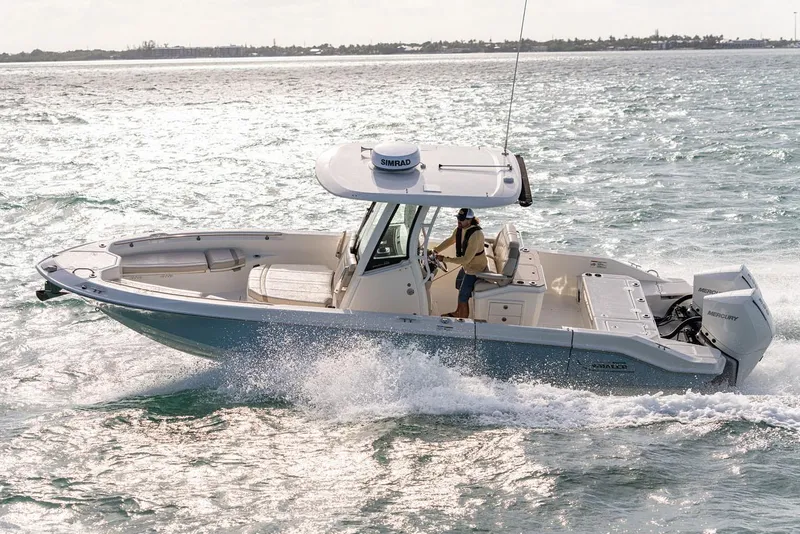 Slide: The Image of 2026 Boston Whaler 280 Dauntless boat interior with cushioned seating and sleek design. - 14