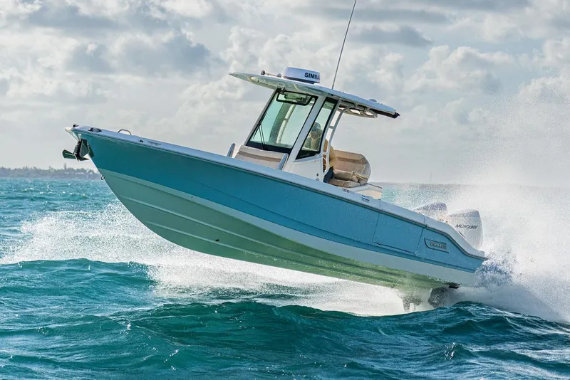 Slide: The Image of 2026 Boston Whaler 280 Dauntless boat interior with white seating and sleek design. - 15