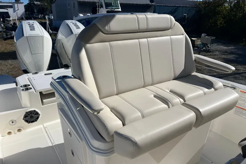 Slide: The Image of 2026 Boston Whaler 280 Dauntless boat with comfortable seating and dual Mercury engines. - 16