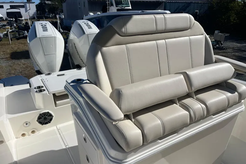 Slide: The Image of 2026 Boston Whaler 280 Dauntless boat with luxurious seating and powerful engines. - 17
