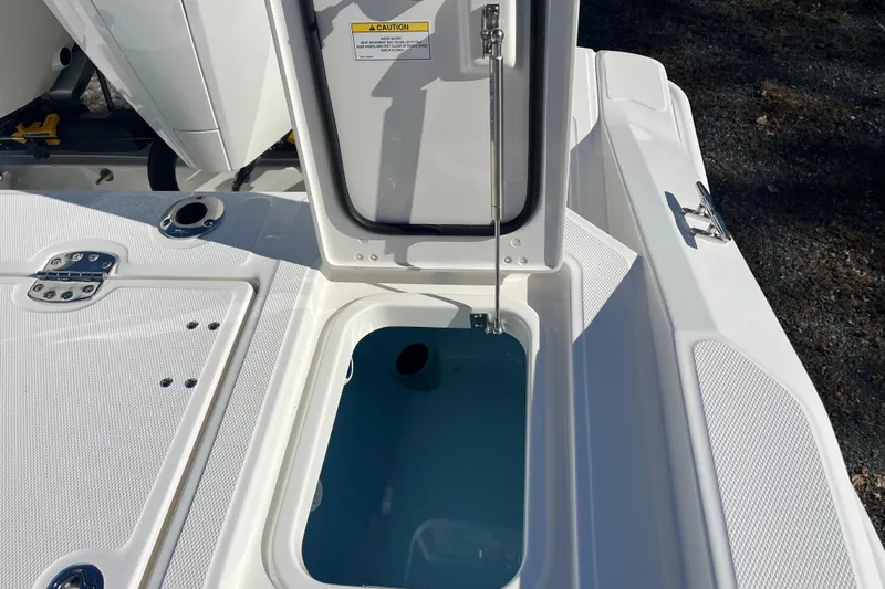 Slide: The Image of 2026 Boston Whaler 280 Dauntless boat storage compartment open, showcasing interior details. - 19
