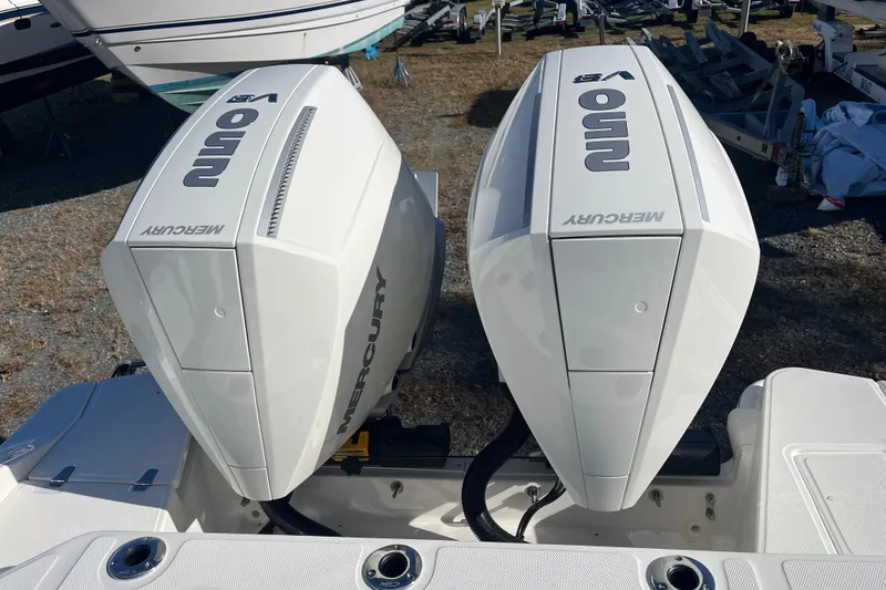 Slide: The Image of Twin Mercury outboard engines on a 2026 Boston Whaler 280 Dauntless boat. - 20