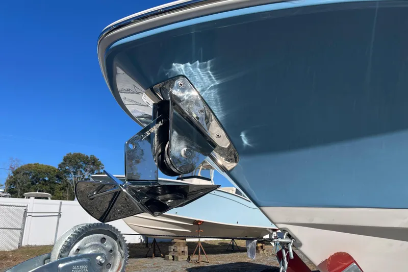 Slide: The Image of Boston Whaler 280 Dauntless 2026 boat with anchor detail against clear blue sky. - 26