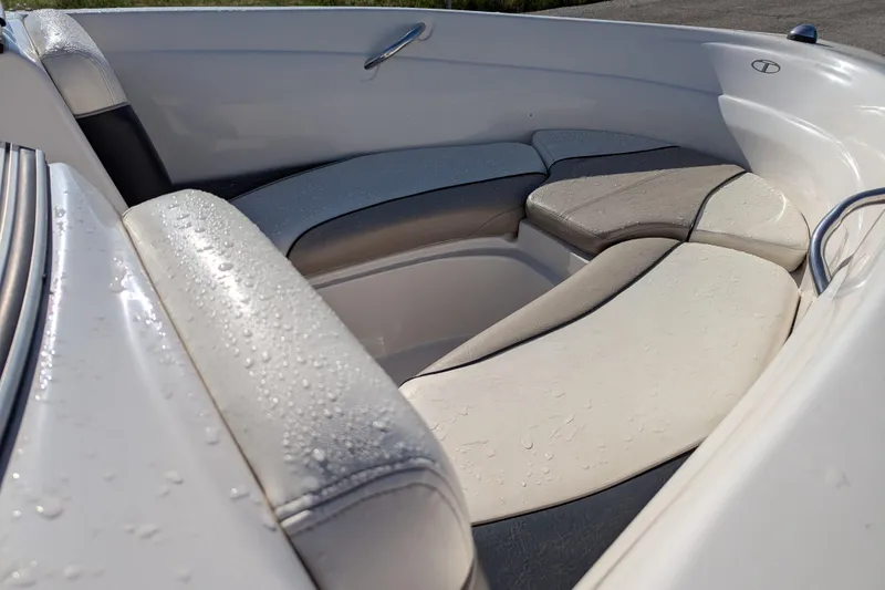 Slide: The Image of 2006 Tahoe Q6 Sport boat interior with wet, cushioned seating. - 14