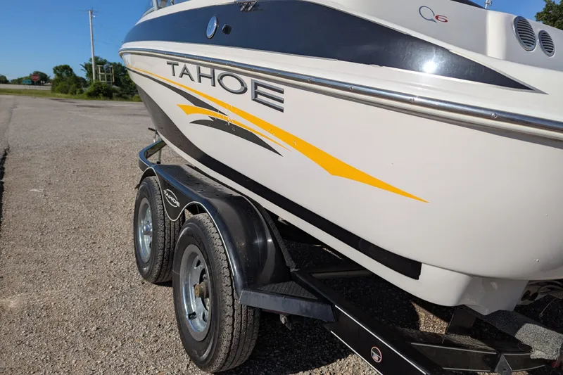 Slide: The Image of 2006 Tahoe Q6 Sport boat on trailer, featuring sleek design and vibrant yellow accents. - 3