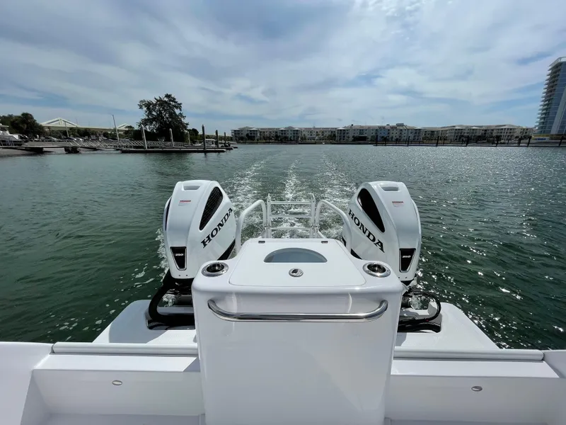 Slide: The Image of ArrowCat 320 boat with dual Honda outboard engines cruising on a sunny day, 2025 model. - 14