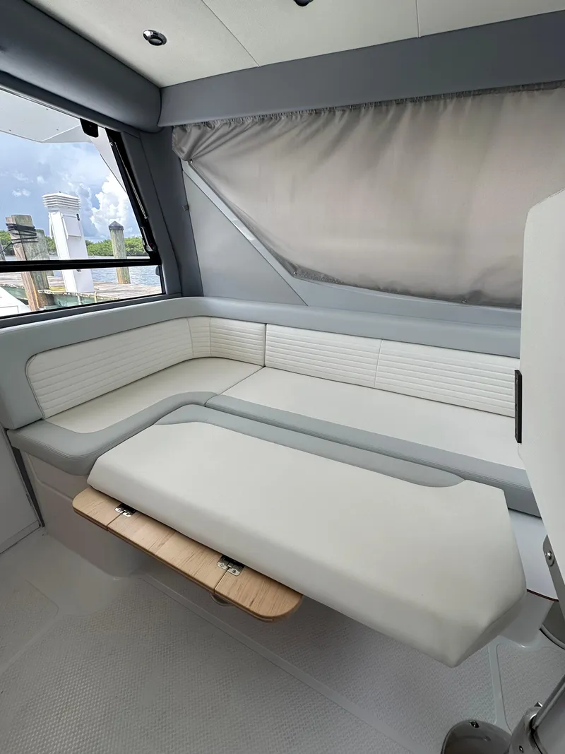 Slide: The Image of Luxurious interior of 2025 ArrowCat 320 boat with modern seating and sleek design. - 5