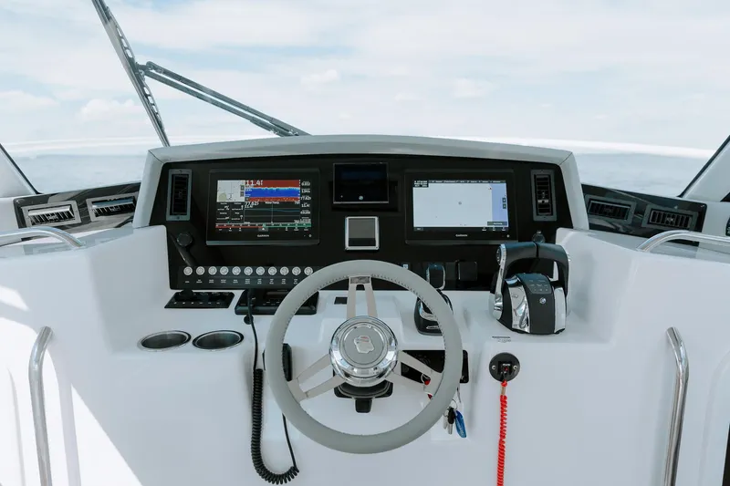 Slide: The Image of Cockpit of 2025 ArrowCat 320 boat with modern navigation and control systems. - 9