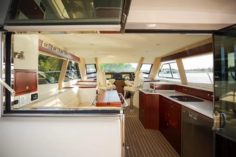 Slide: The Image of Luxurious interior of 2025 ArrowCat 420 Coupe yacht with modern kitchen and helm. - 2