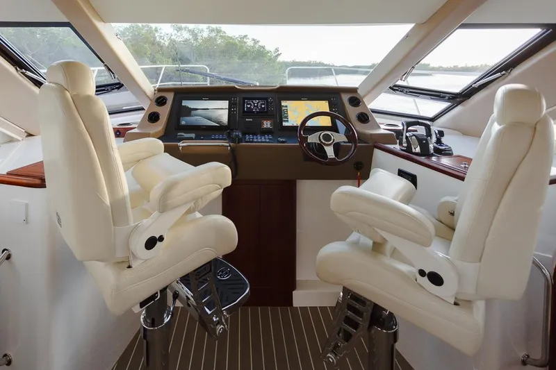 Slide: The Image of Luxury interior of 2025 ArrowCat 420 Coupe with modern navigation system and plush seating. - 4