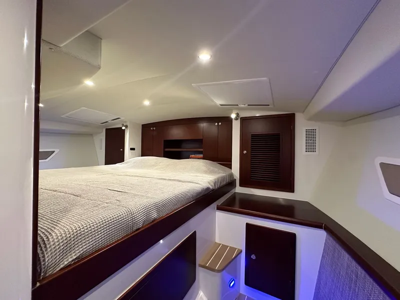 Slide: The Image of Luxurious interior cabin of 2025 ArrowCat 420 Coupe with modern lighting and wood finishes. - 6